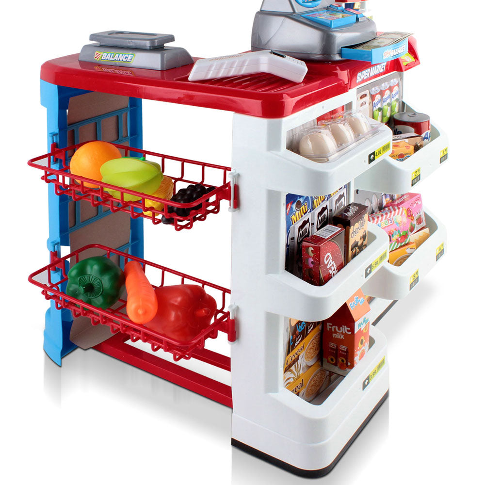 Toy supermarket set with shelves and cash register on a white background